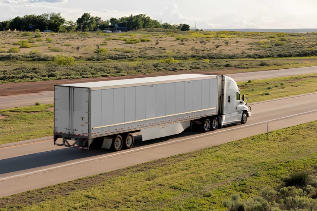 Full truckload trailer travelling on an open highway